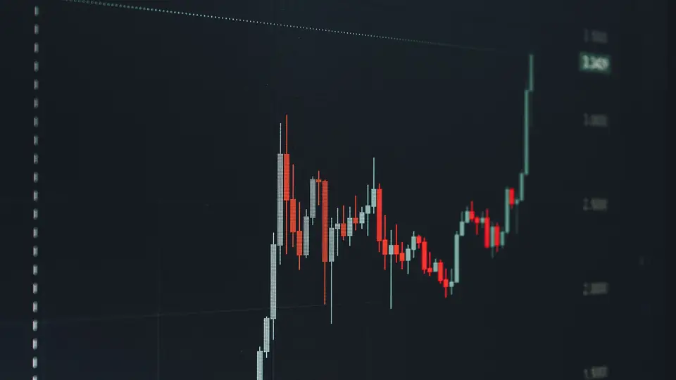 A rising chart line on a screen